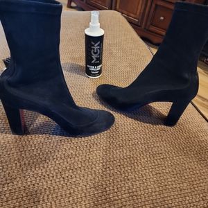 Black Christian Louboutin ankle boots.